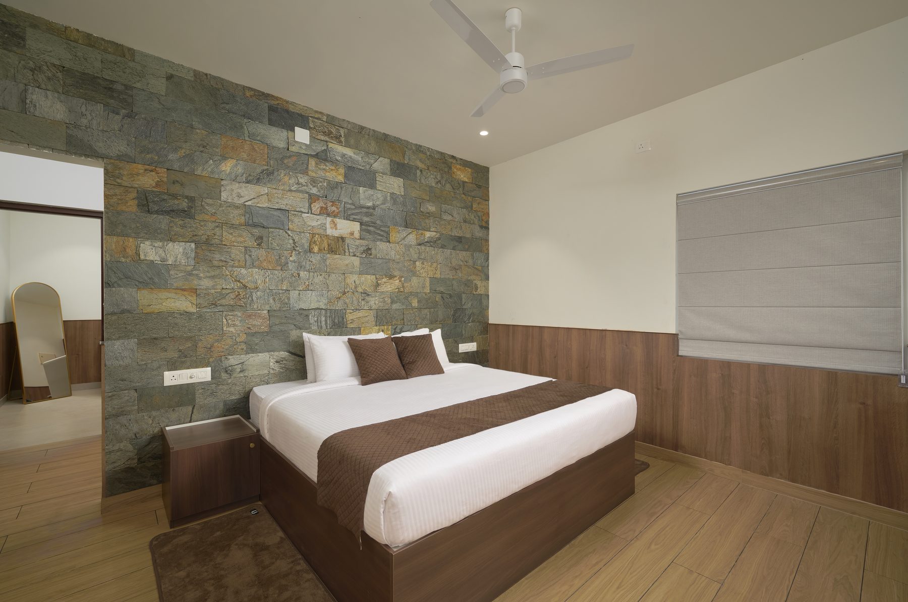The Reach Vagamon — Suite Room — bedroom with the stone accent wall
